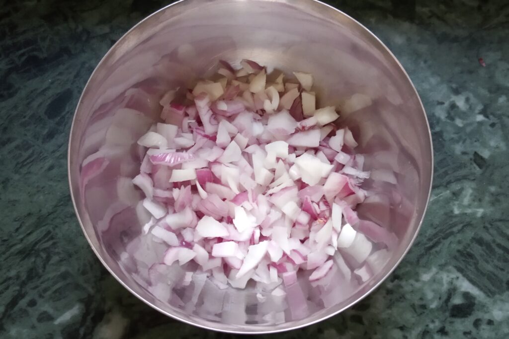 chopped onions in a mixing bowl
