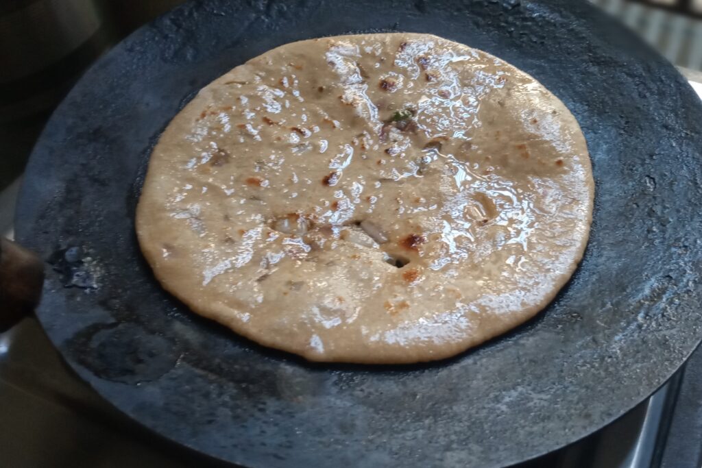 pyaz paratha is cooked with ghee