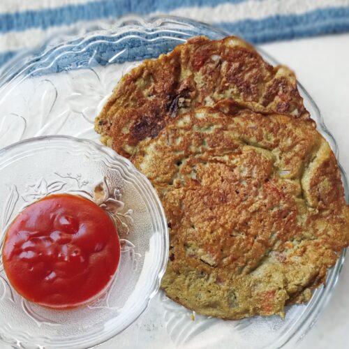 green moong dal chilla served with tomato ketchup