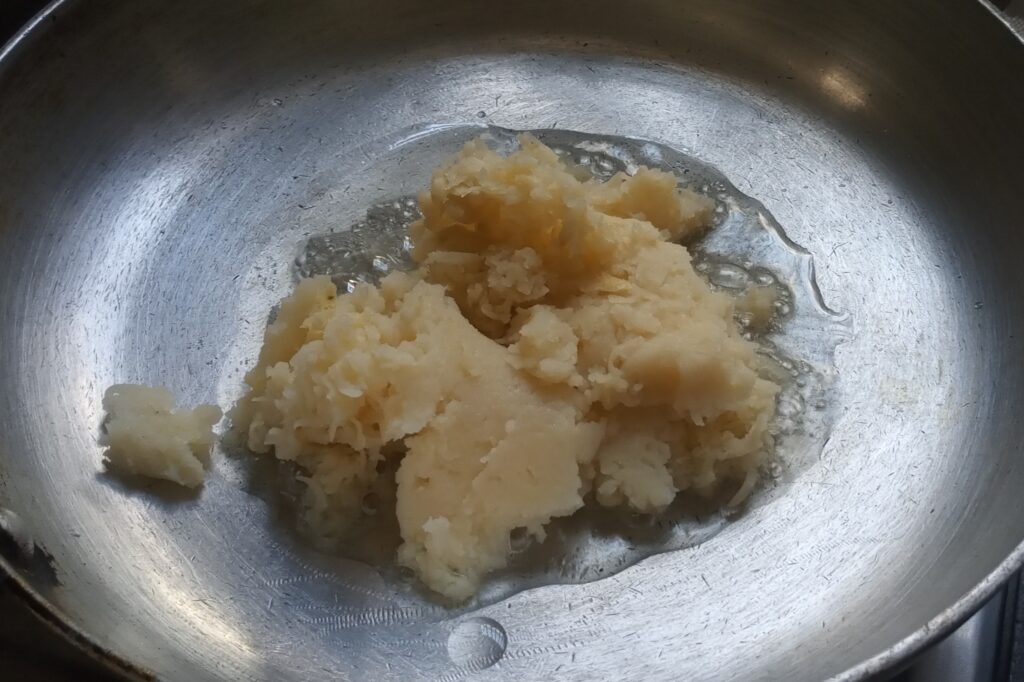 add potatoes in a heated ghee
