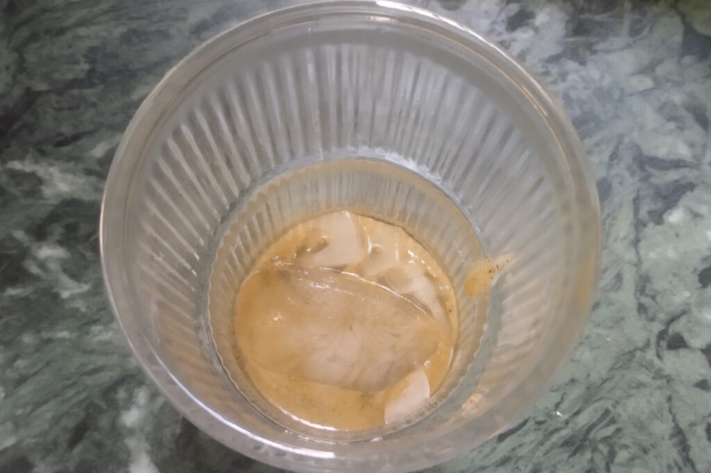 concentrate and ice cubes in a glass