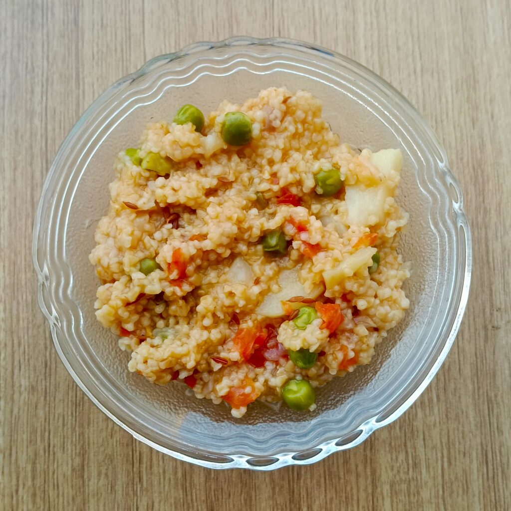 top shot of vegetables daliya bowl on wooden table