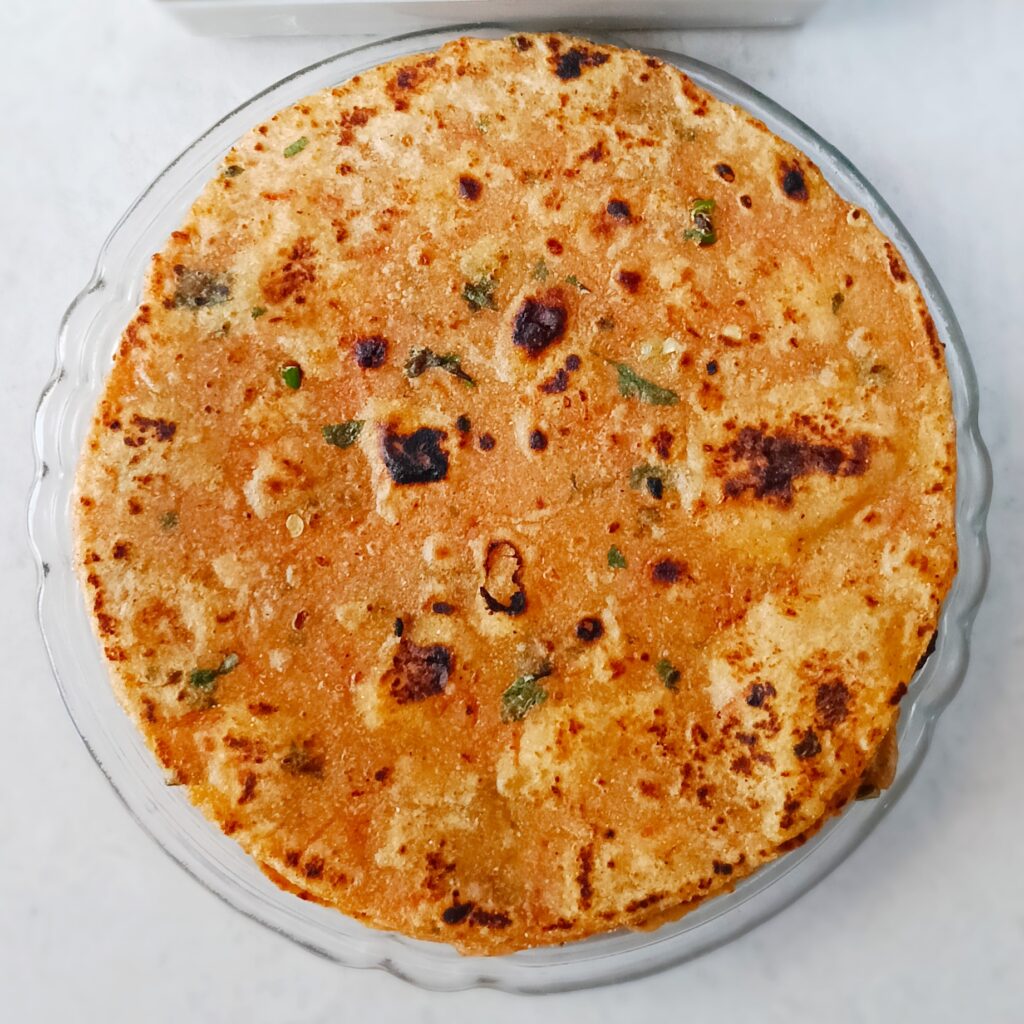 carrot paratha served in a plate