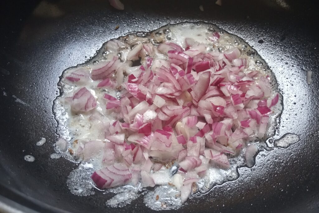 add chopped onion in ghee