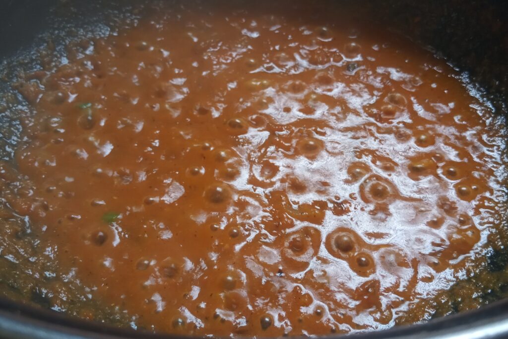 sauteing tomato puree with spices