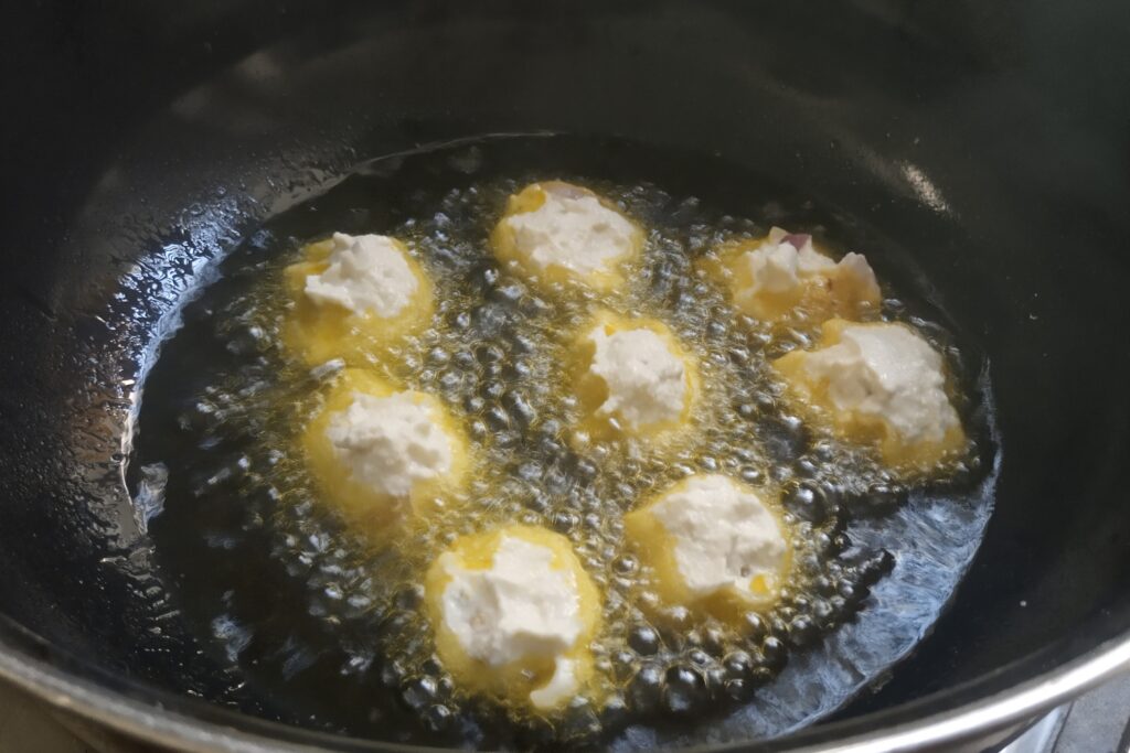 dropping fritters in hot oil