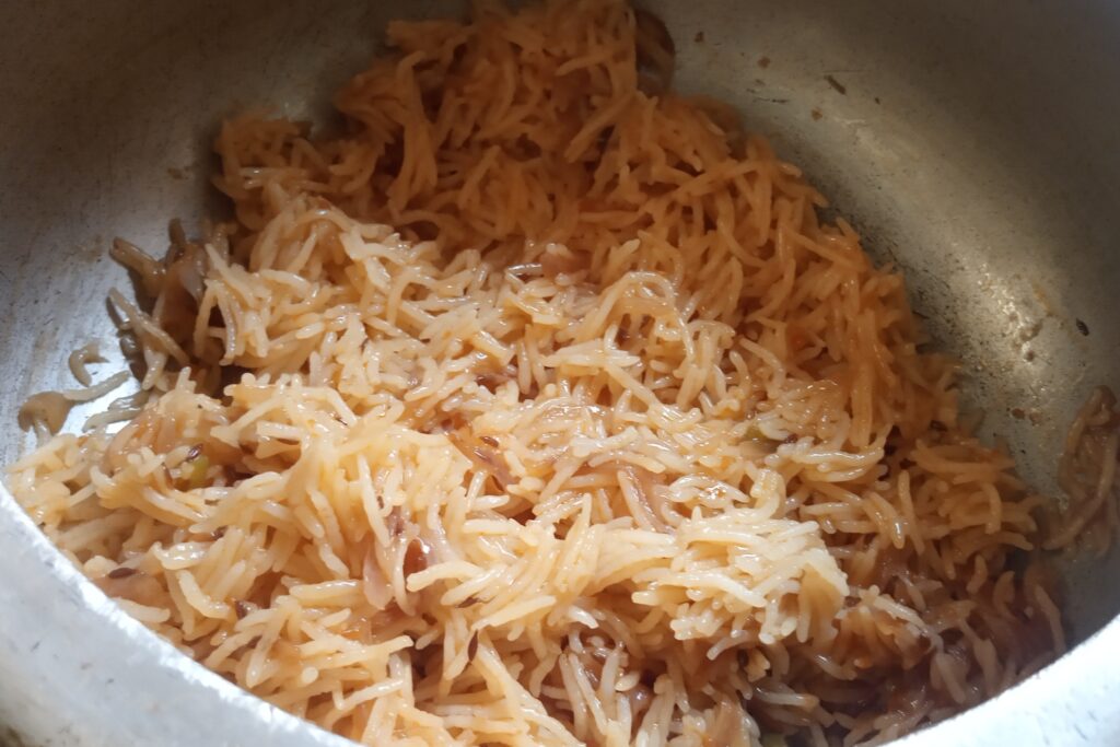 fluff pyaz pulao with a spoon