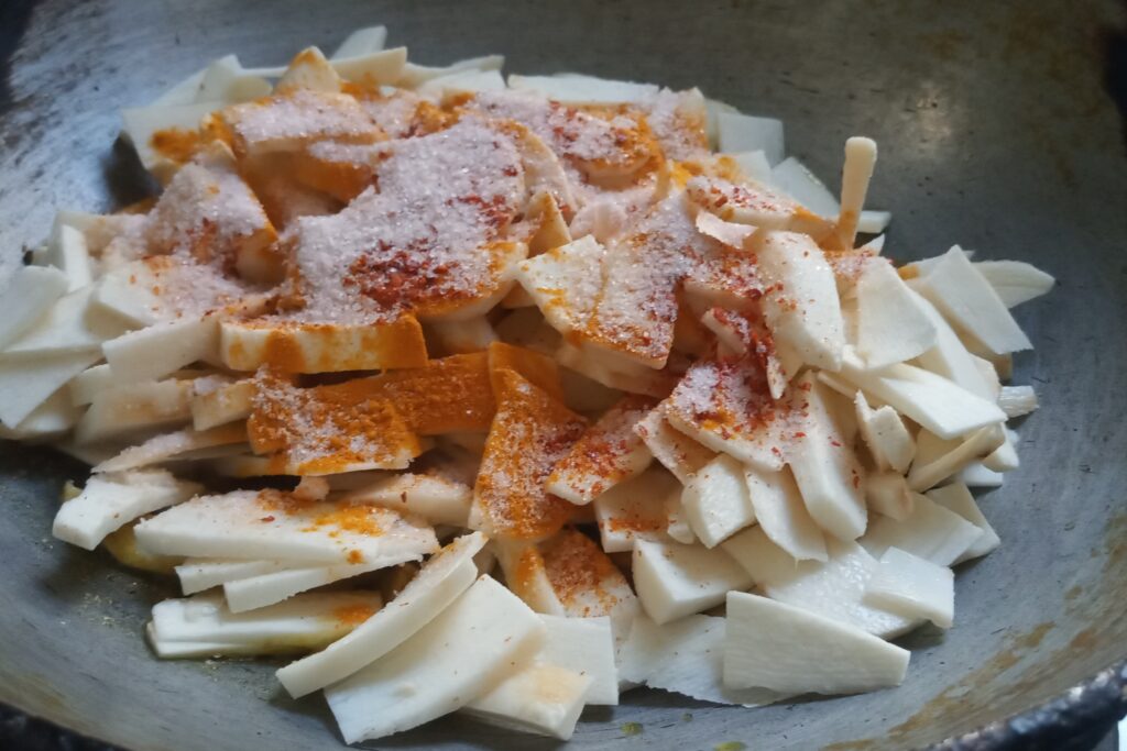 season spices in the sliced taro root