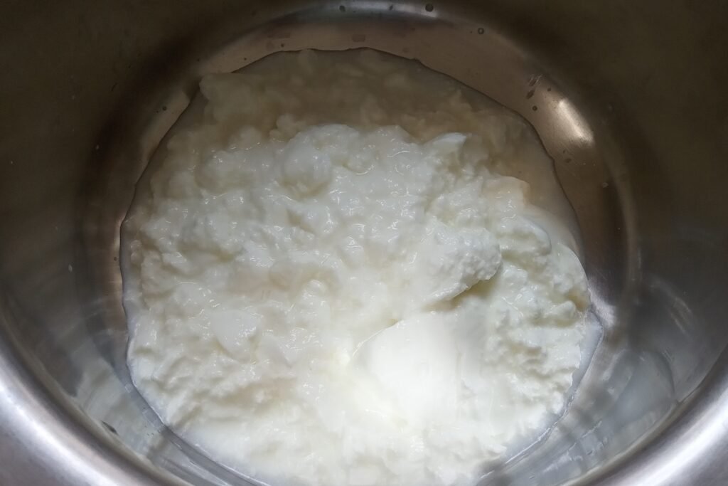 fresh and thick curd in a mixing bowl