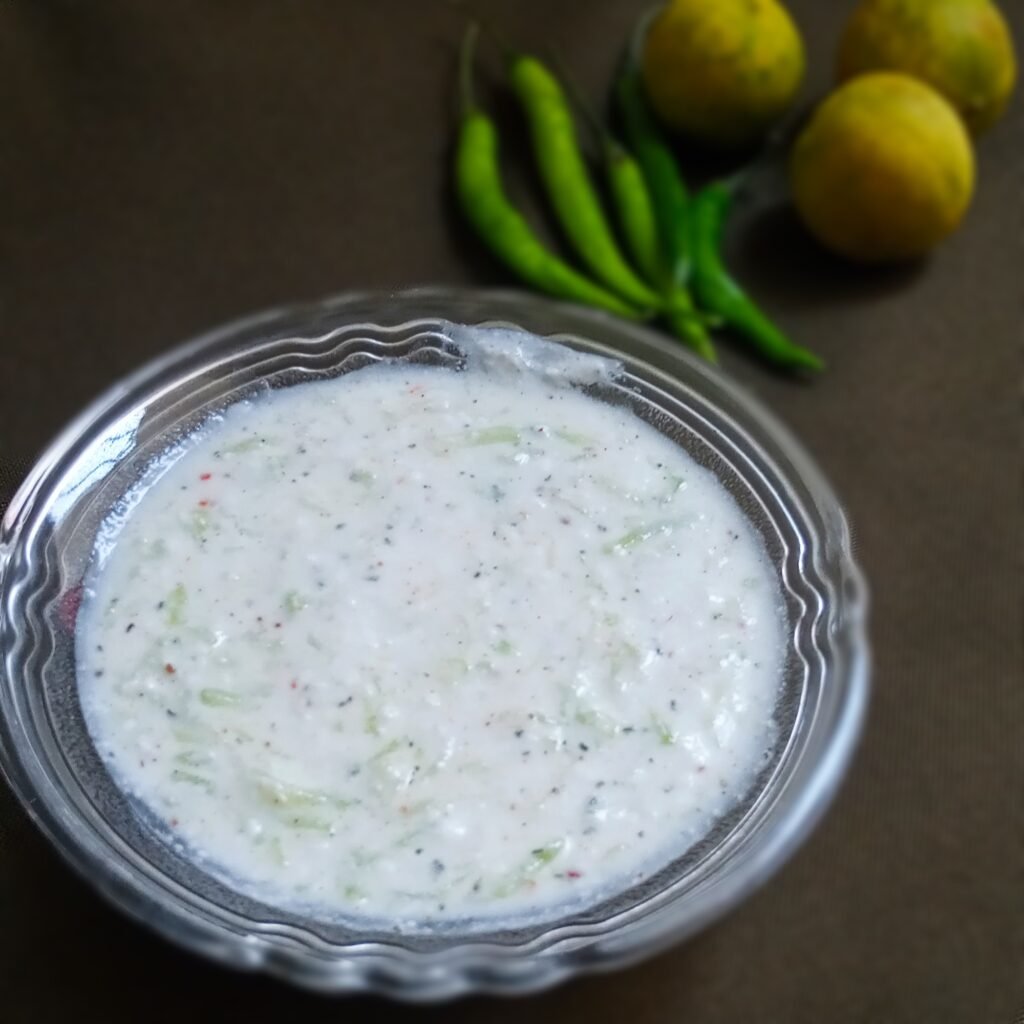 close up shot of bottle gourd raita chilies and lemon