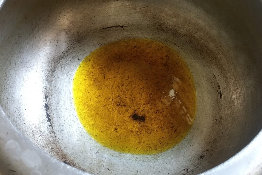 heating oil in a pressure cooker