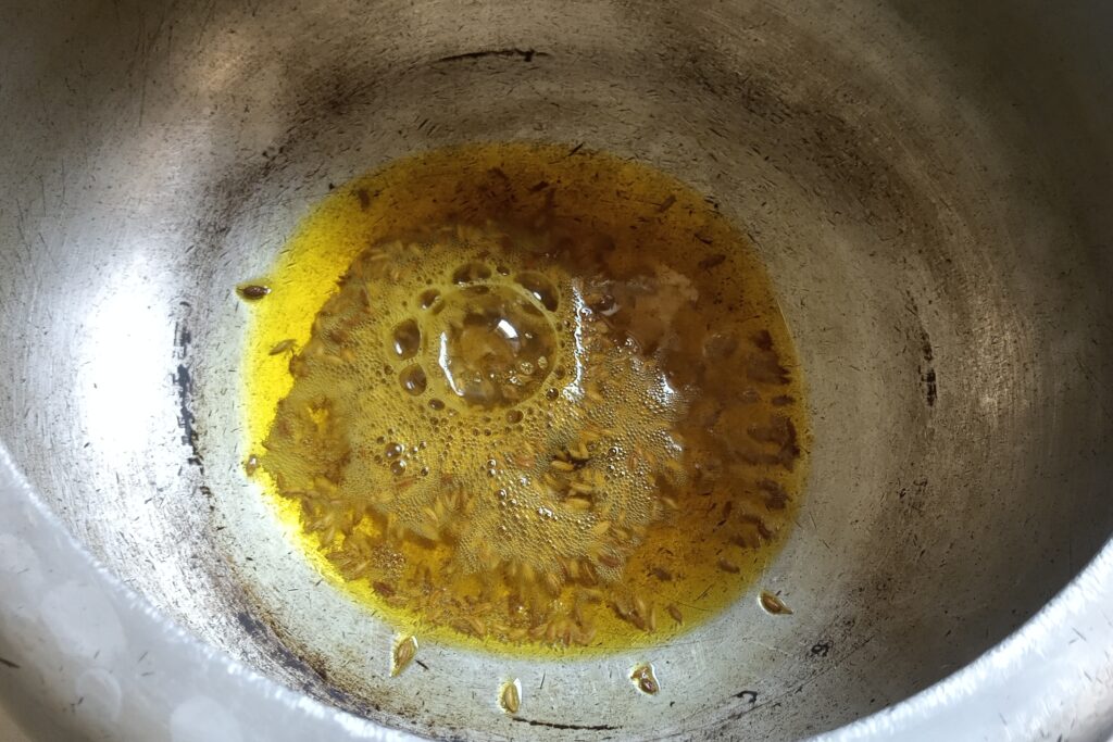tempering cumin seeds in hot oil