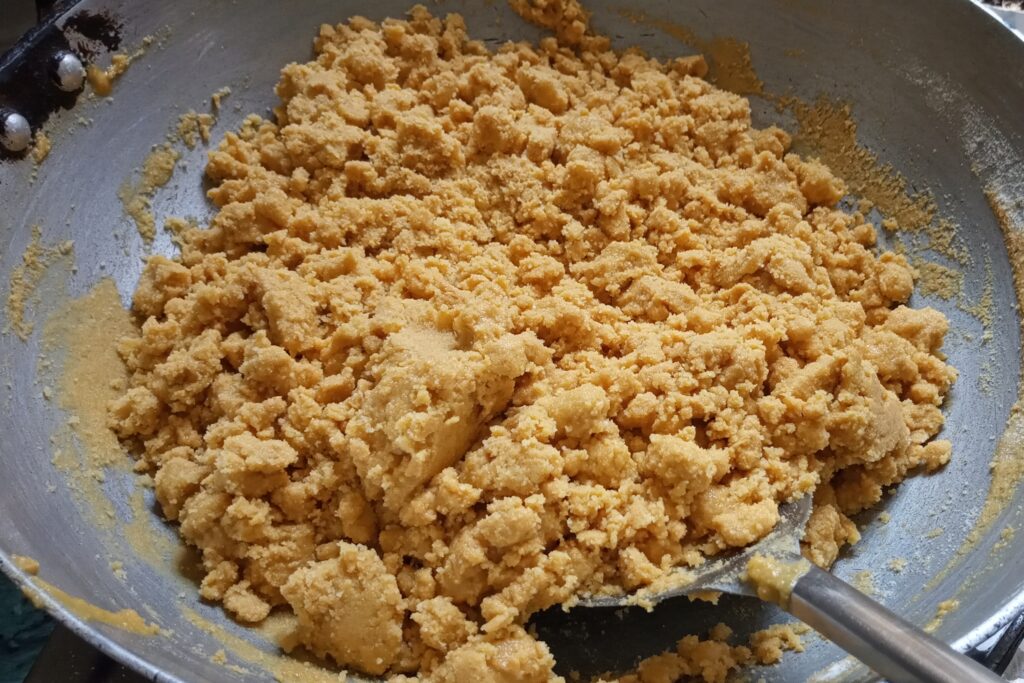 mixing sugar with roasted gram flour