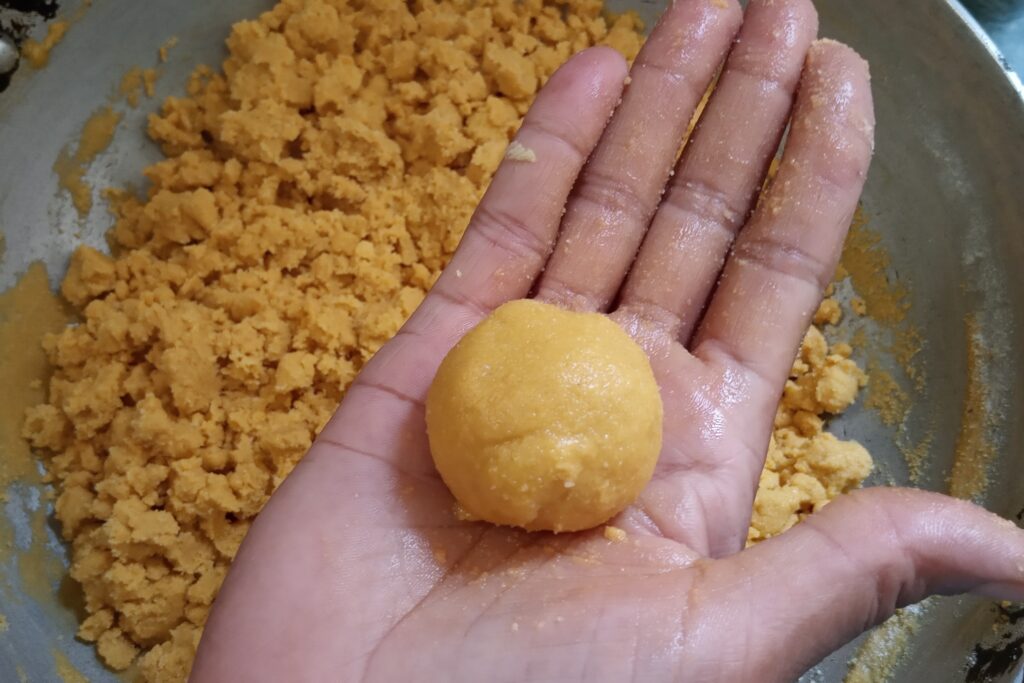 shaping ladoo from the mixture
