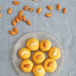 besan ladoo recipe garnished with nuts