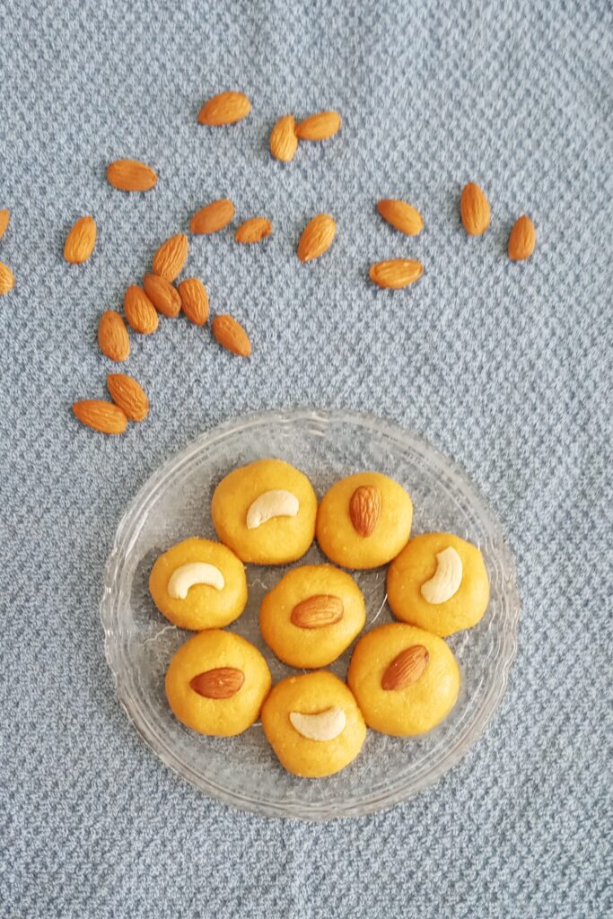 top shot of besan ladoo recipe and almonds