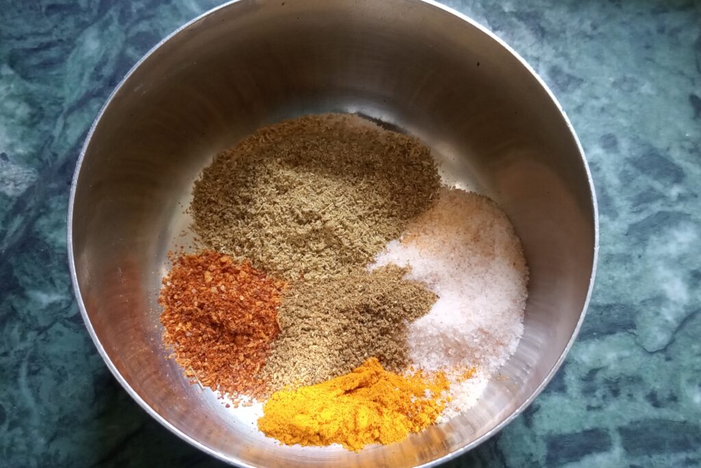 ground spices in a mixing bowl