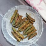 served bharwa bhindi in a glass plate
