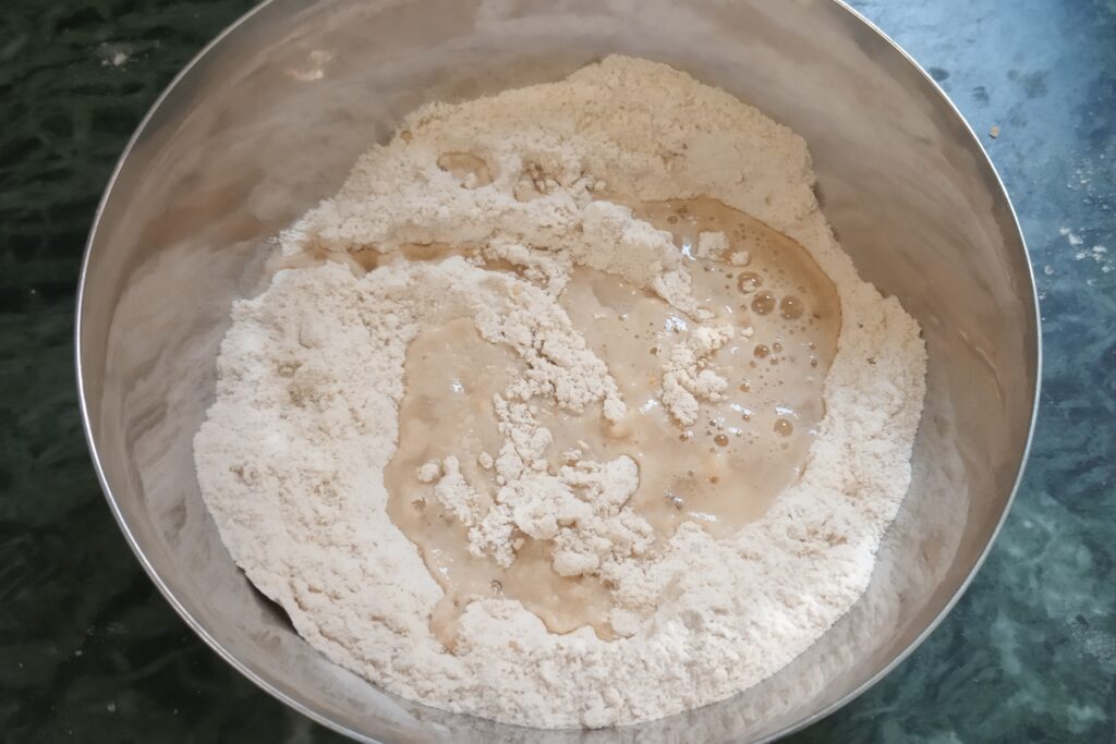 water and flour in bowl to knead dough