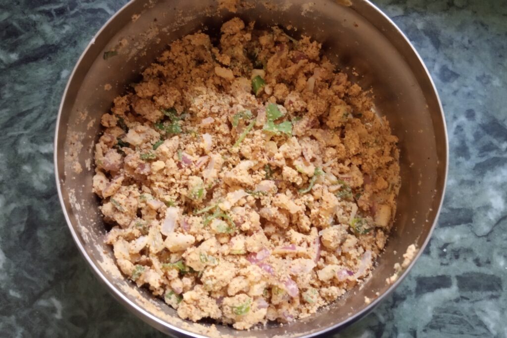 mixing all ingredients for sattu stuffing