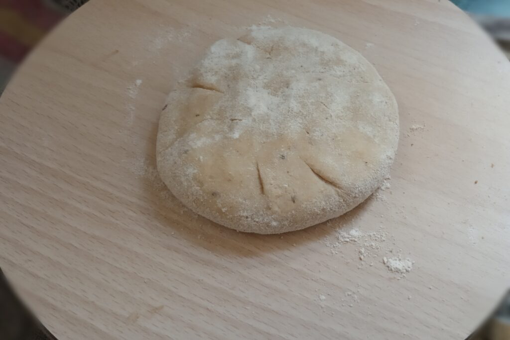 flatten the sattu ball on the board