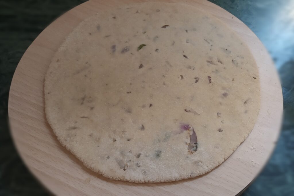 rolled sattu stuffed circle on the board