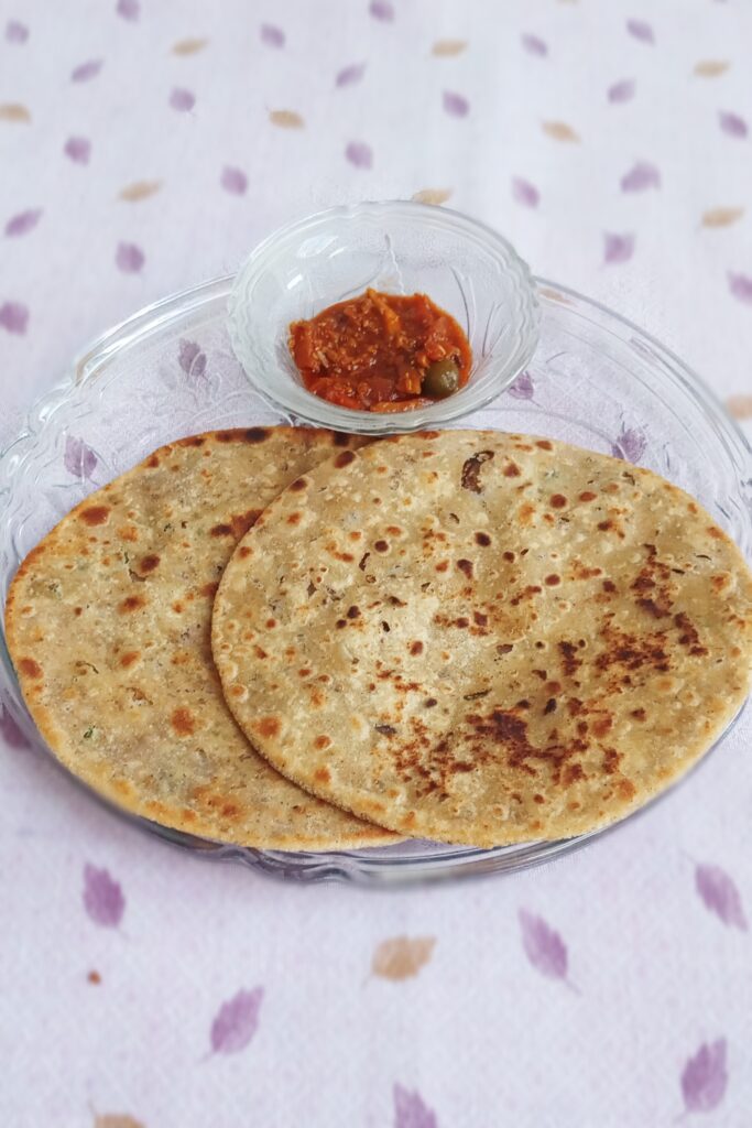 close up view of sattu paratha recipe and mixed pickle