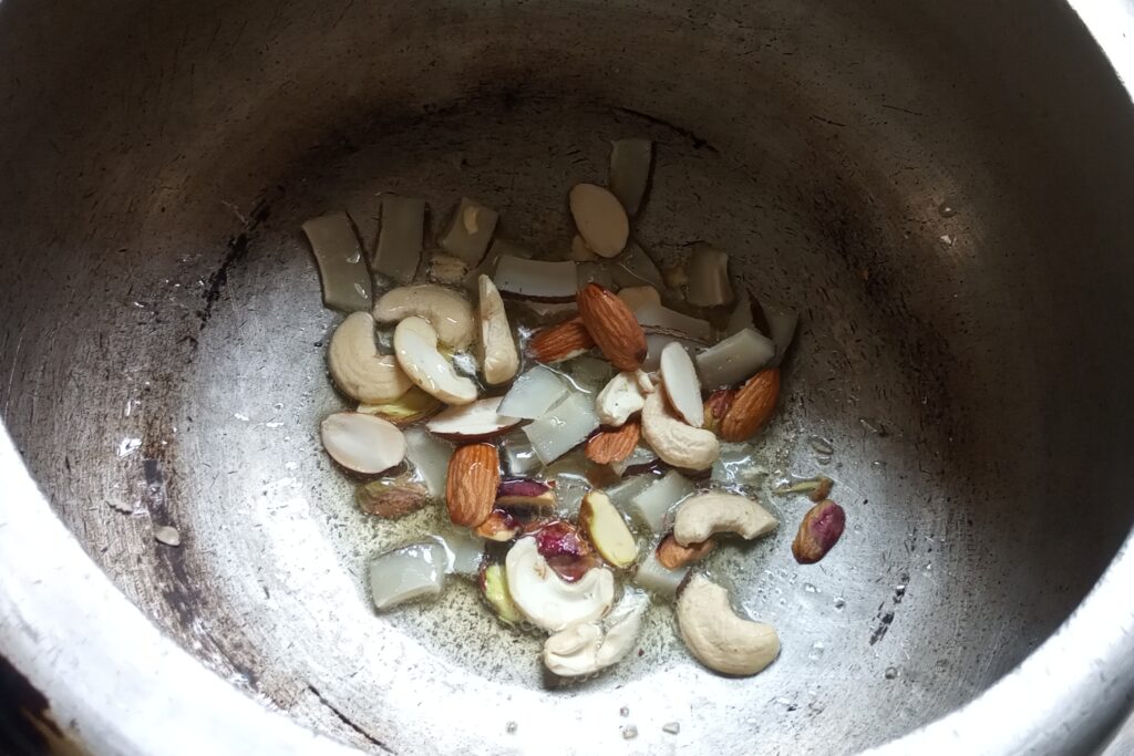 roasting nuts in the heated ghee