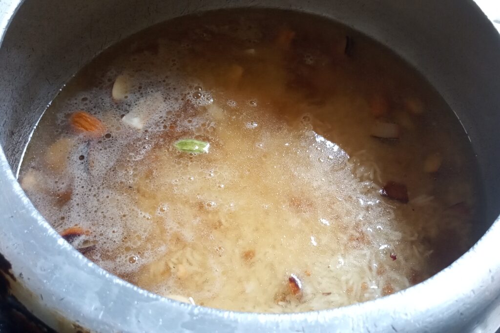 adding water to jaggery and rice