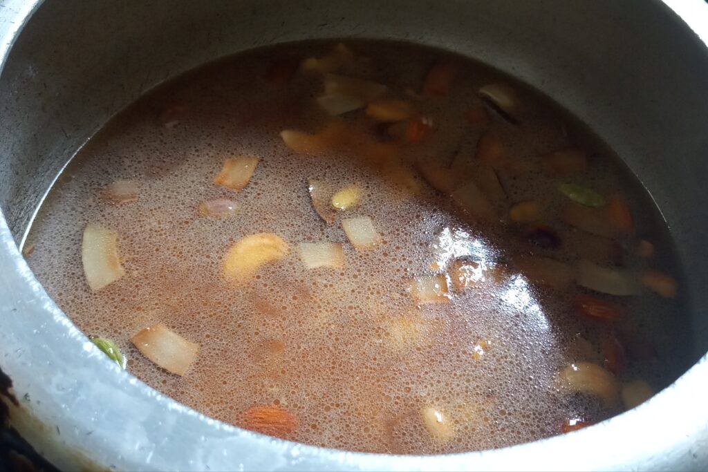 cooking jaggery rice in a pressure cooker