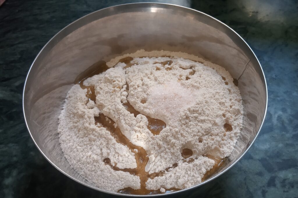 adding oil and salt to the flour