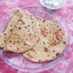 soft and crispy paneer paratha in a plate