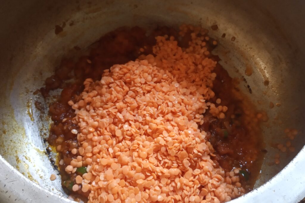 adding washed red lentils
