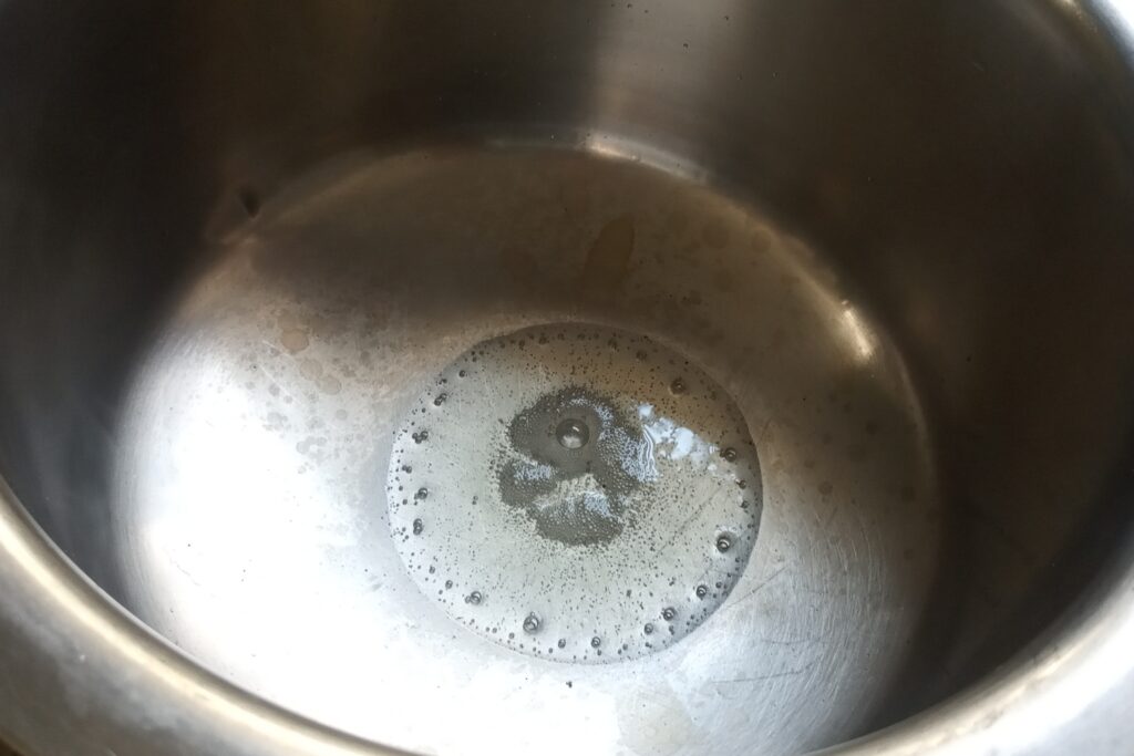 heating ghee in a cauldron