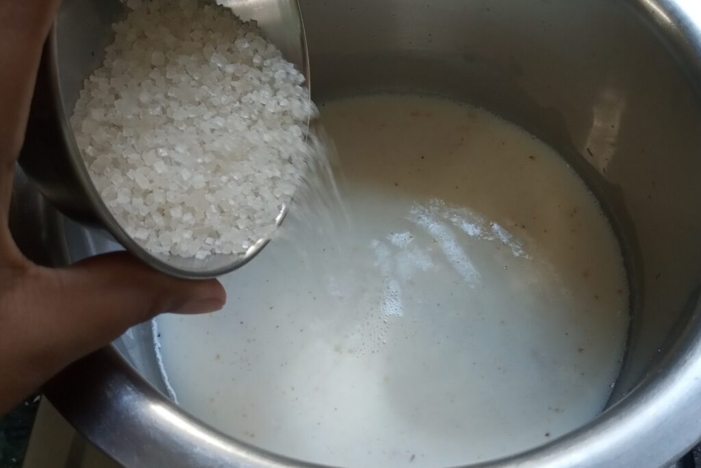 adding sugar in the milk and oats