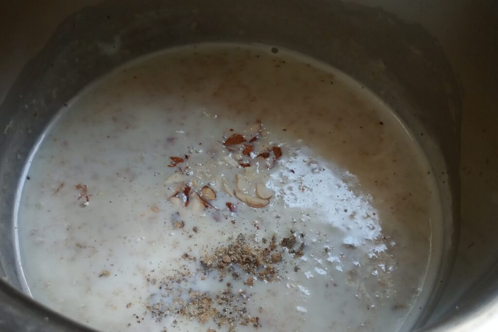 adding nuts and cardamom powder in the kheer