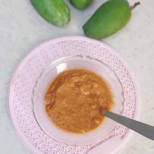 raw mango chutney on pink surface