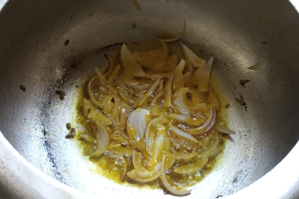 adding sliced onions to saute
