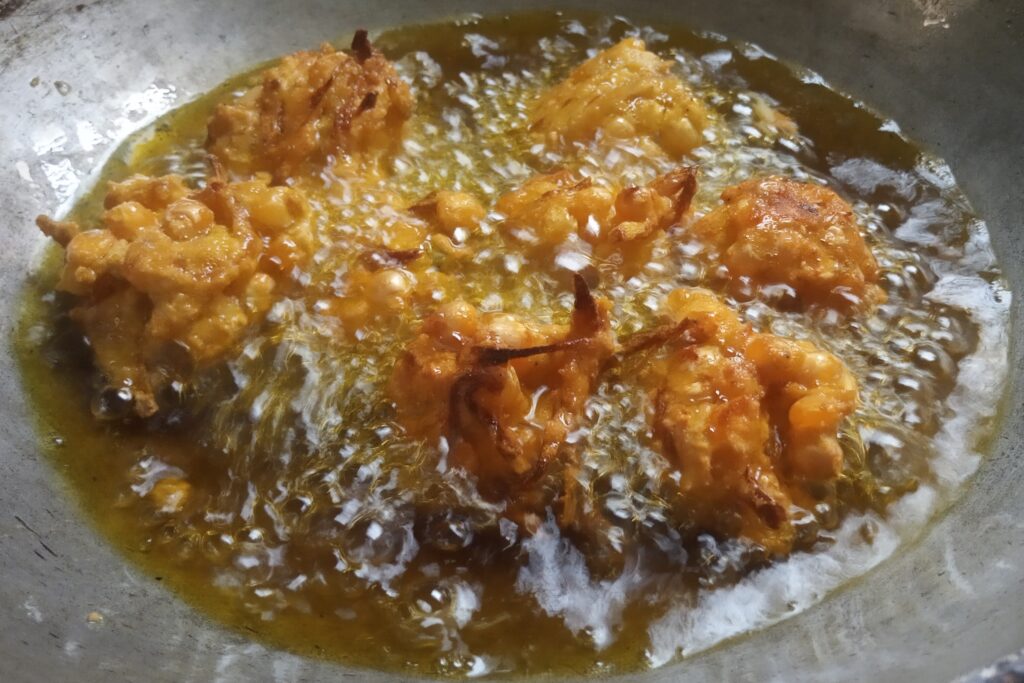 the corn pakoras are fried completely