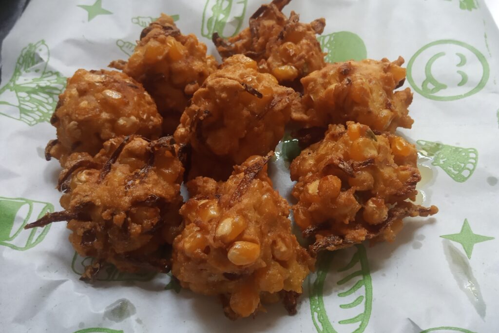 sweet corn fritters on kitchen paper 