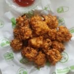 corn pakora or corn fritters served with tomato ketchup