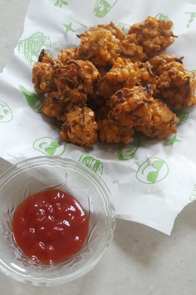 sweet corn pakora served with tomato ketchup