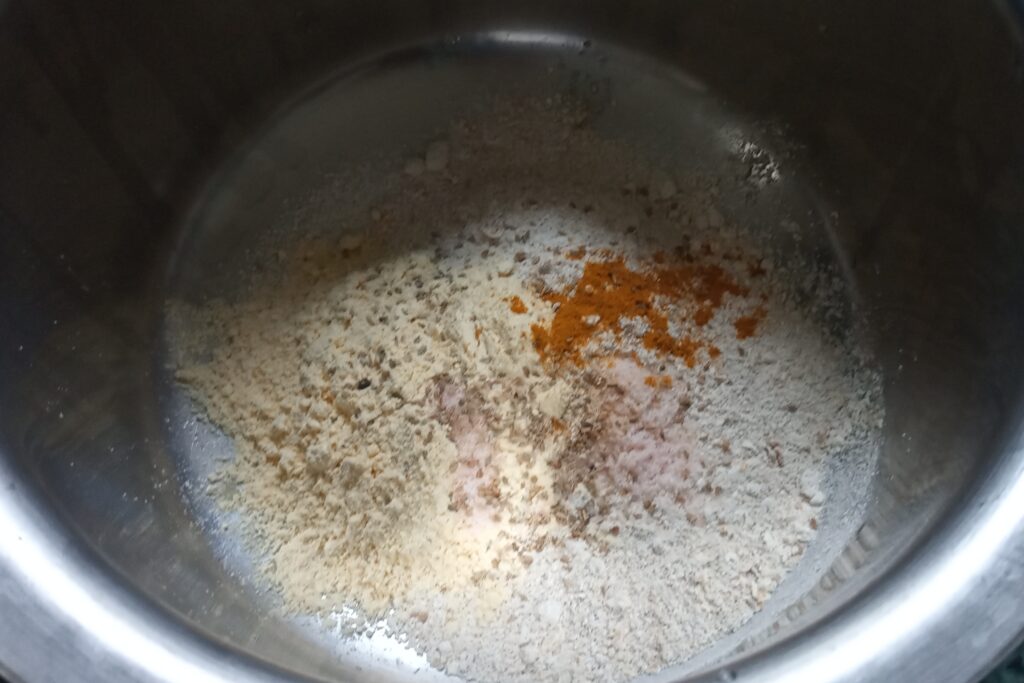 seasoning turmeric and salt to the flour