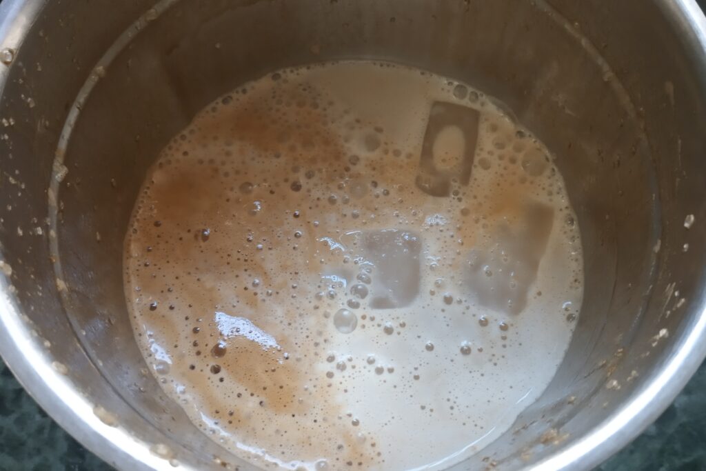 Adding milk to make a coffee