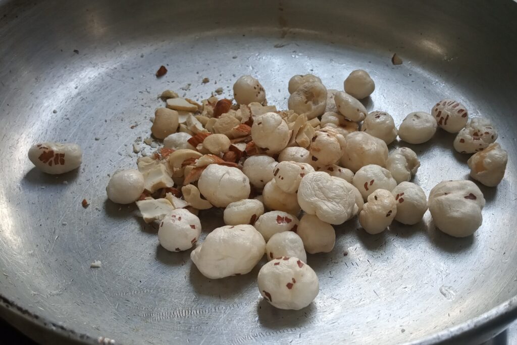 Adding fox nuts almonds and cashews