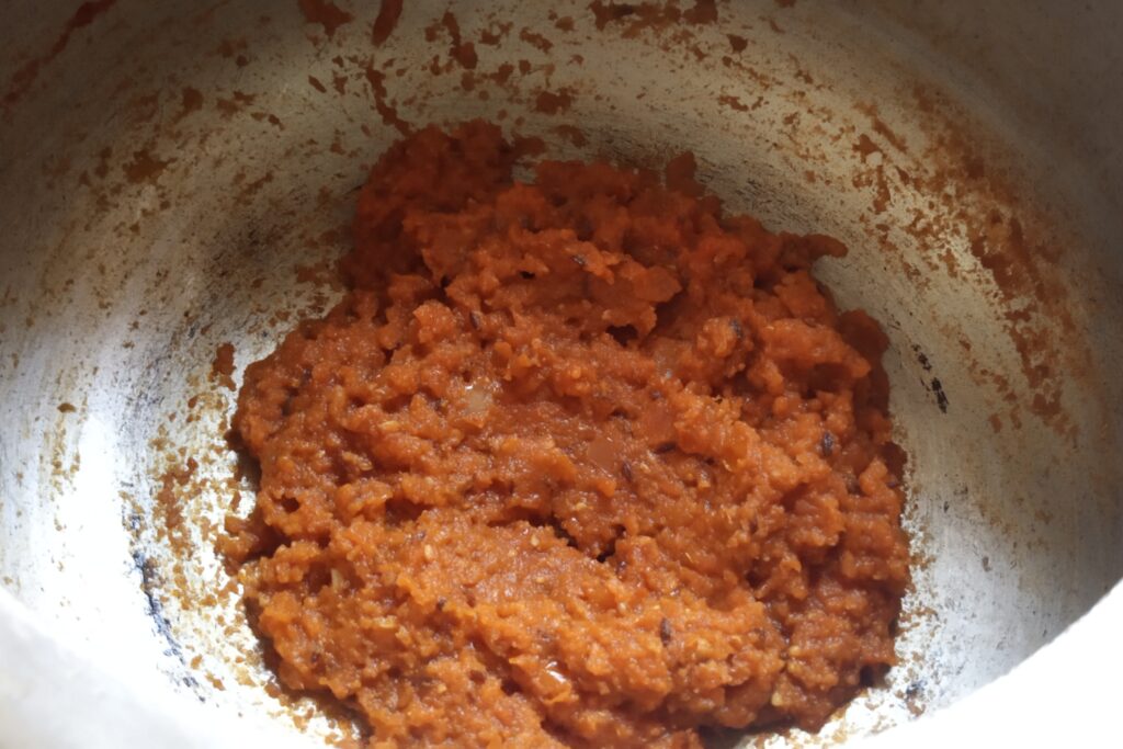 Tomato masala is cooked