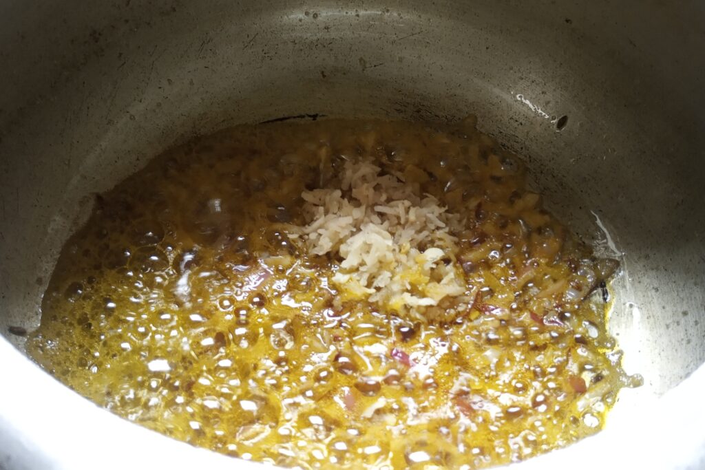 Adding ginger garlic paste