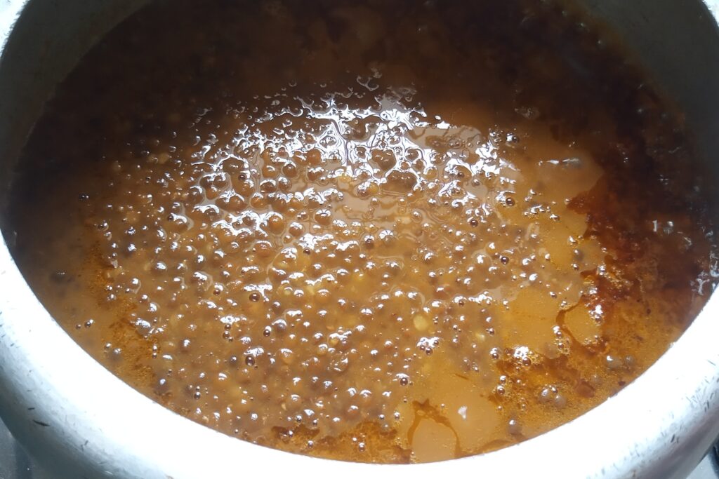 Adding cooked masoor dal