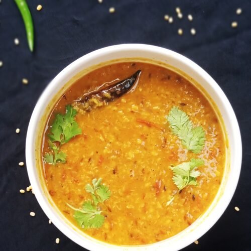 Moong dal tadka garnished with coriander leaves