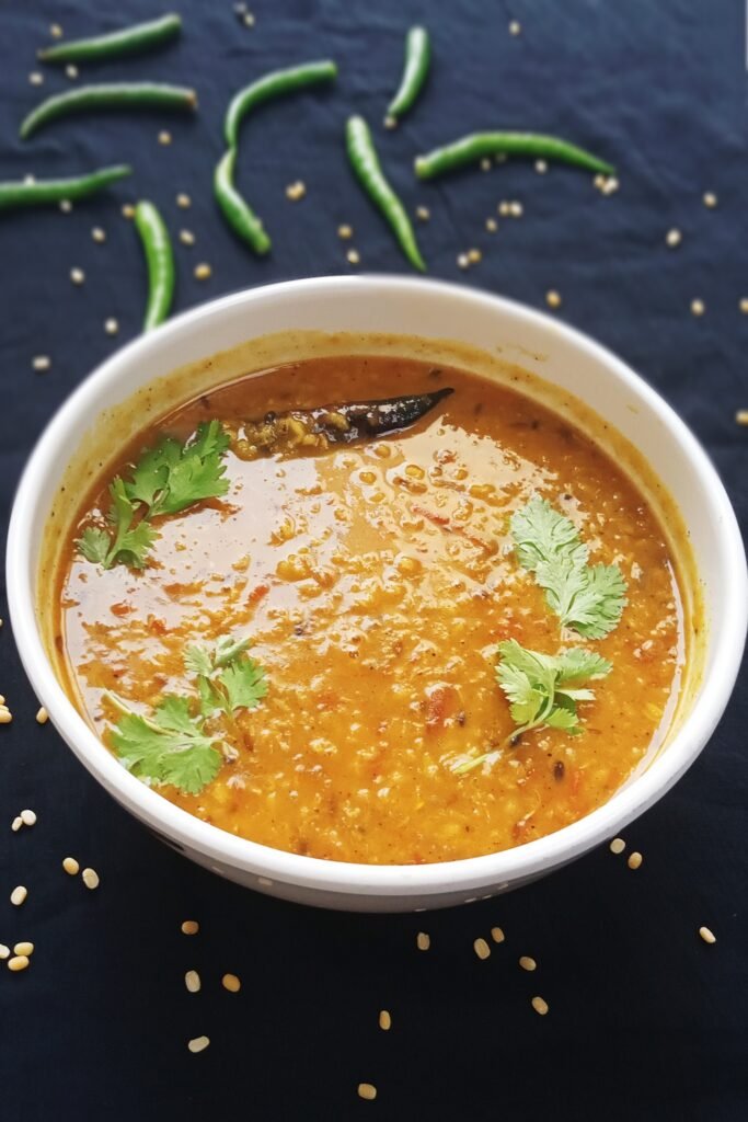 Yellow lentils curry served hot